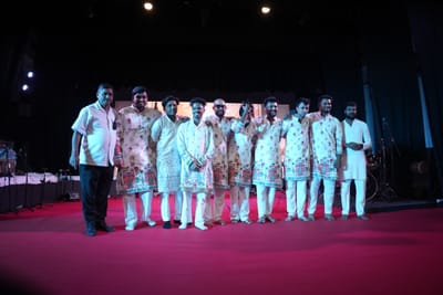 The full Antara band lined up across the stage at the close, arms around each other.